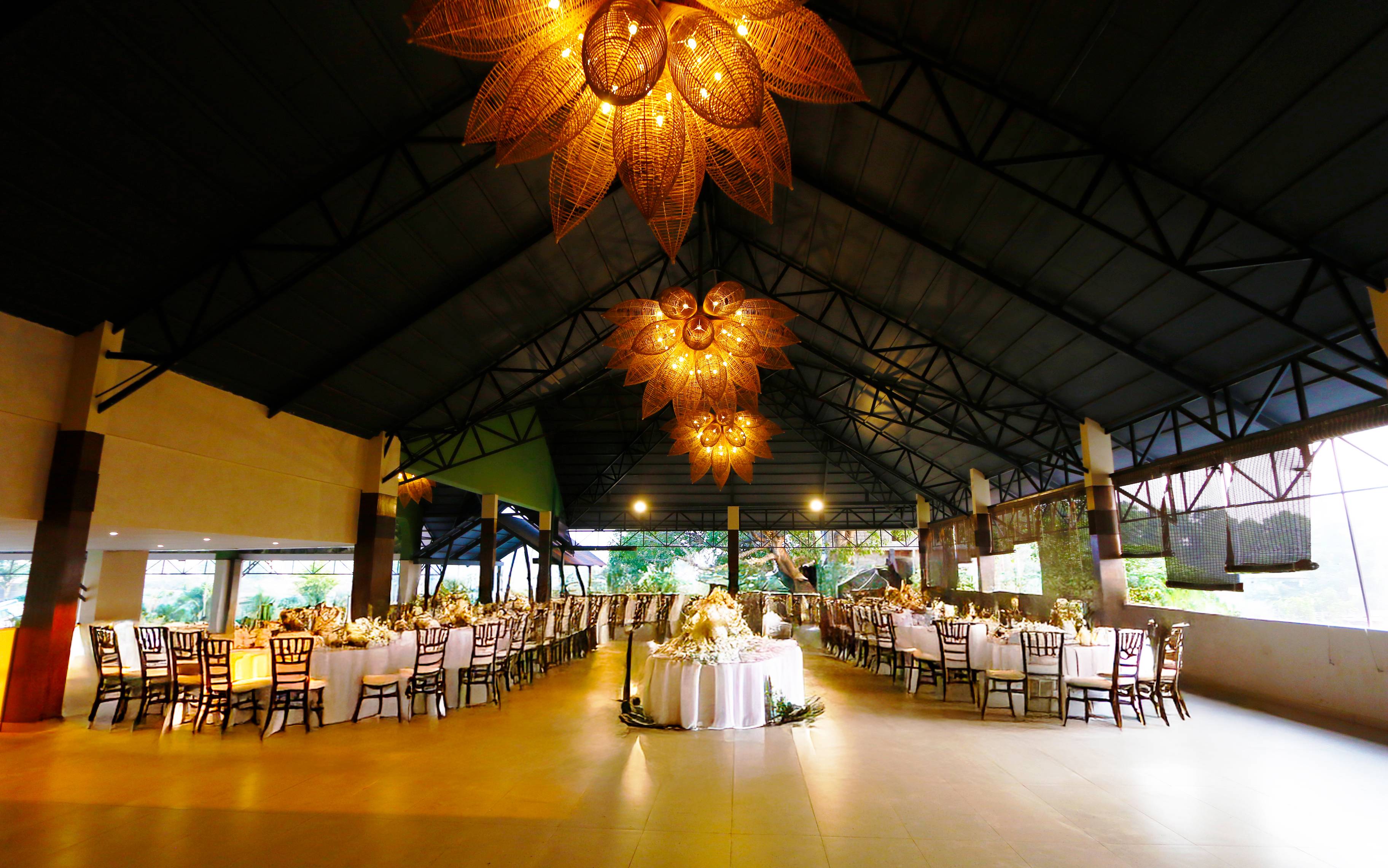 Maya Dining Deck with dining tables and woven lotus chandeliers