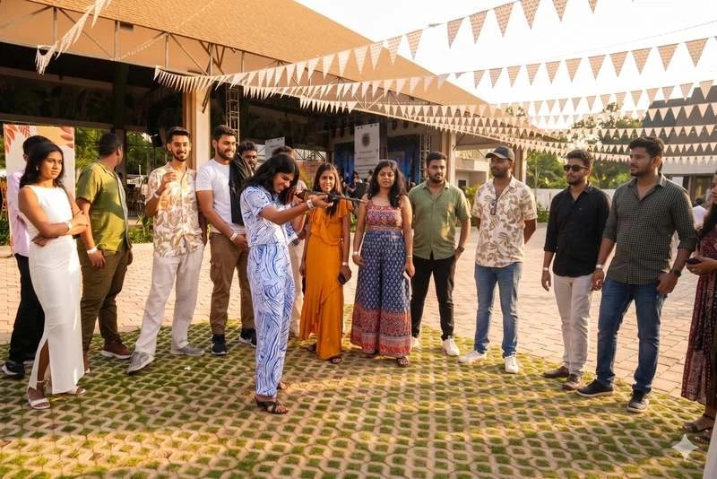 A team photographed under bunting at an offsite