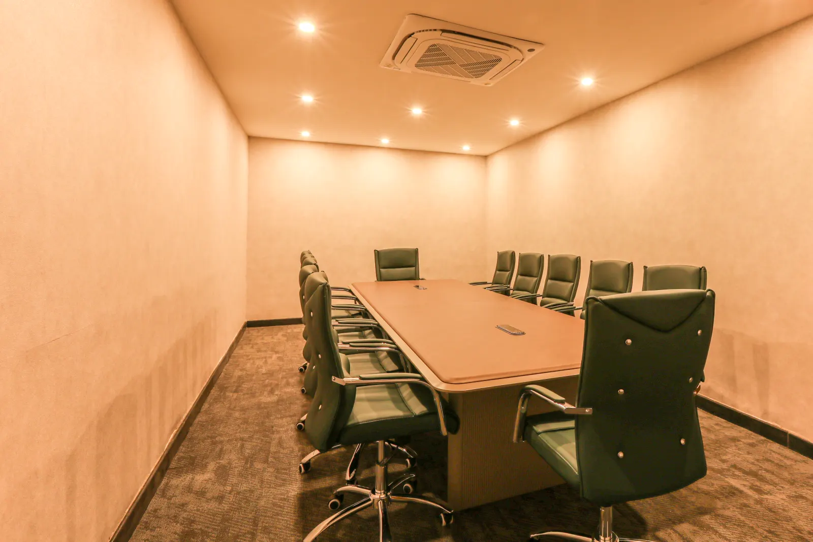 The boardroom from the doorway, with the screen at the far end