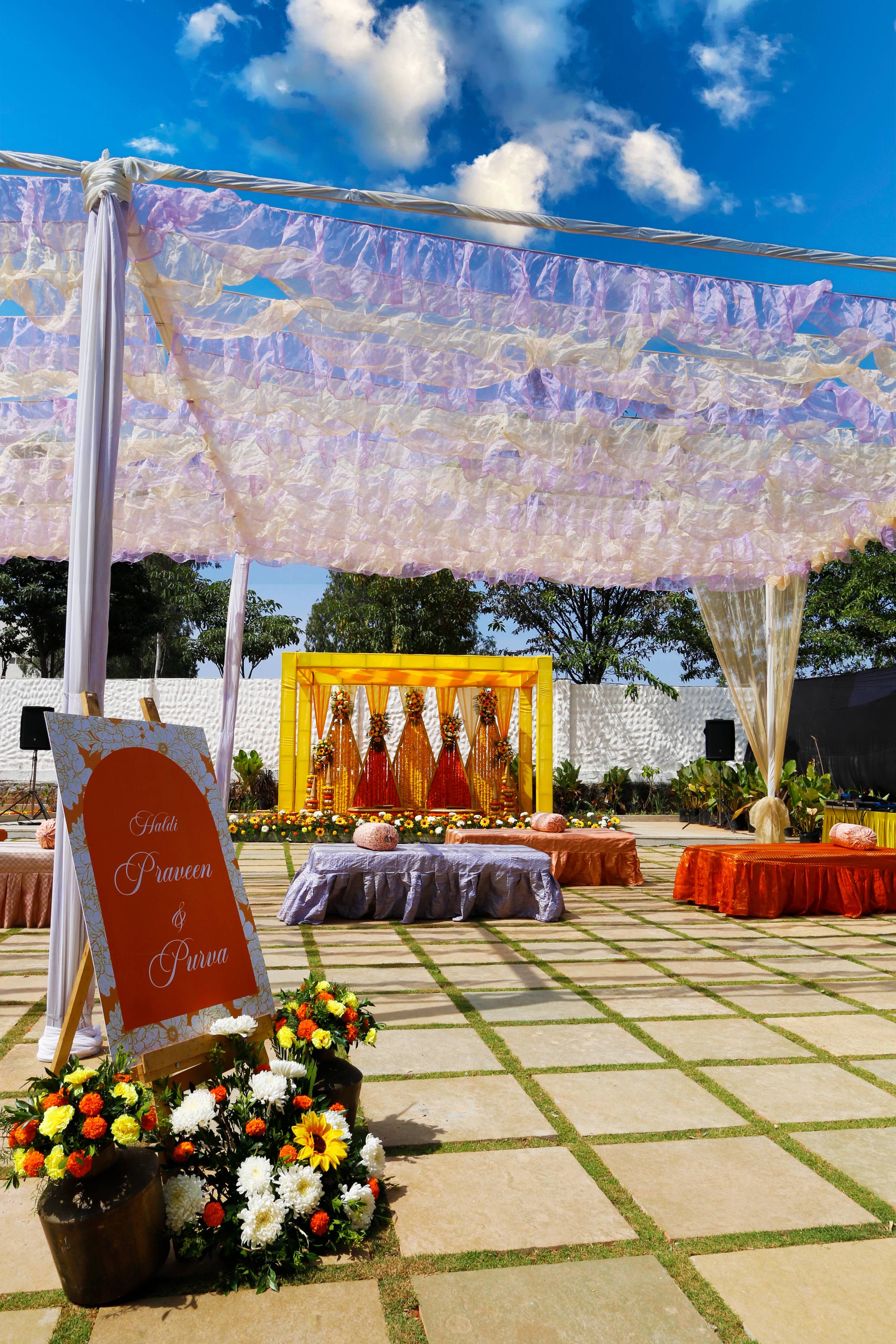 The poolside court dressed in marigolds for a haldi
