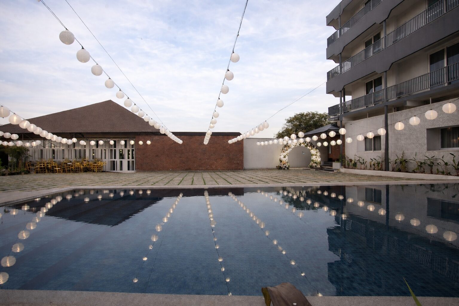 Aavya Poolside Court and the pool in the evening