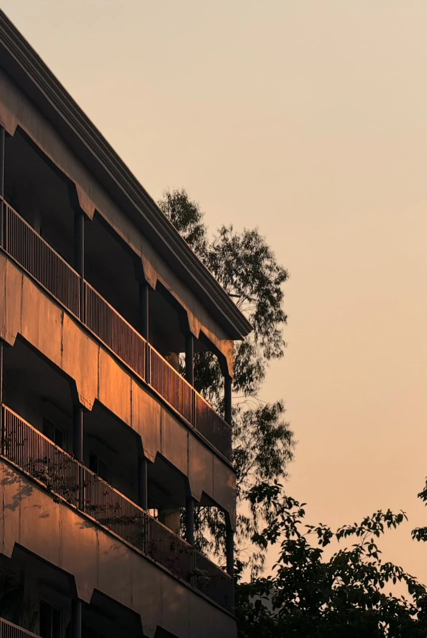The Rumah block at dusk with its balconies lit
